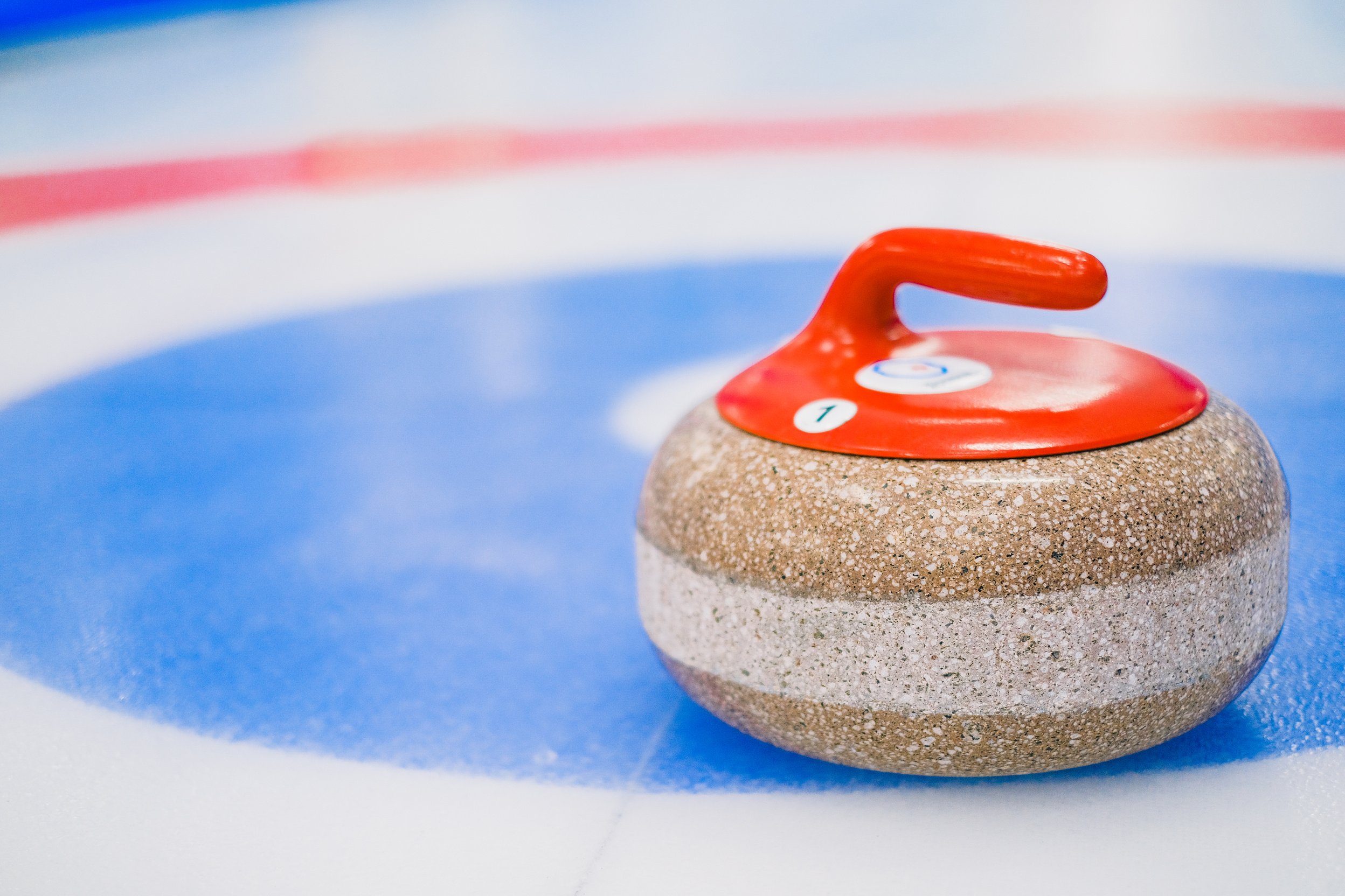 Curling stone on ice surface